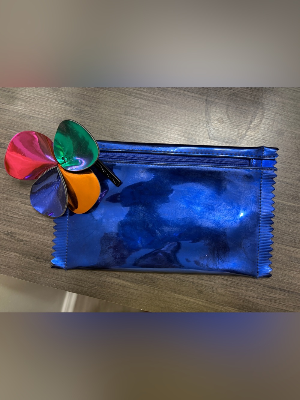Shiny Metallic Blue Pouch with Multicolor Flower Charm